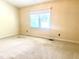 Bedroom with carpet, one window, and neutral-colored paint at 5500 Fortunes Ridge Dr # 82B, Durham, NC 27713