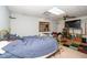 This is a bedroom with a gold bed frame, TV and a shelf at 5500 Fortunes Ridge Dr # 82B, Durham, NC 27713