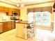Kitchen area with white cabinets, stainless steel dishwasher, and eat-in table at 5500 Fortunes Ridge Dr # 82B, Durham, NC 27713