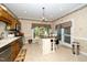 Functional kitchen featuring a center island and stainless steel dishwasher; sunny breakfast nook at 5500 Fortunes Ridge Dr # 82B, Durham, NC 27713