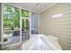 Screened patio features an opening to a wood deck and a calming view of mature trees and foliage at 5500 Fortunes Ridge Dr # 82B, Durham, NC 27713