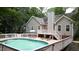 Outdoor space featuring a fenced pool area with a large deck and outdoor furniture at 5600 Treestand Ct, Garner, NC 27529
