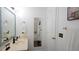 This bathroom includes a sink, mirror, tile floors and a view of the shower at 5600 Treestand Ct, Garner, NC 27529