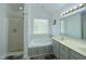 This bathroom has dual sinks, a soaking tub with tile surround, and a separate shower at 5600 Treestand Ct, Garner, NC 27529
