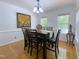 Bright dining room with seating for six and a view of the yard at 5600 Treestand Ct, Garner, NC 27529