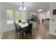 Eat-in kitchen features a white table and chairs and view into the kitchen at 5600 Treestand Ct, Garner, NC 27529