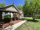 A well-maintained front yard complements the brick and siding exterior of this inviting home at 5600 Treestand Ct, Garner, NC 27529