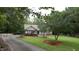 A well-maintained front yard complements the brick and siding exterior of this inviting home at 5600 Treestand Ct, Garner, NC 27529