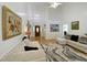 Open living room boasts wood floors, high ceilings, and abundant natural light at 5600 Treestand Ct, Garner, NC 27529