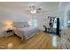 Bright main bedroom with a tray ceiling and exercise equipment at 5600 Treestand Ct, Garner, NC 27529