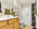 Well-maintained bathroom with a shower-tub combo and functional vanity at 5860 Andover Dr, Graham, NC 27253