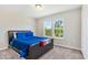Comfortable bedroom featuring new carpet, a double window, and neutral paint at 5860 Andover Dr, Graham, NC 27253