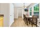 Dining room with wood table set, chandelier, and television at 5860 Andover Dr, Graham, NC 27253