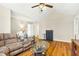 Spacious living room with vaulted ceilings, hardwood floors, and a comfortable seating area at 5860 Andover Dr, Graham, NC 27253