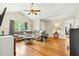 Open living room with hardwood floors, vaulted ceiling, and lots of natural light at 5860 Andover Dr, Graham, NC 27253