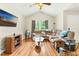 Bright living room featuring a vaulted ceiling, hardwood floors, and a comfortable sectional sofa at 5860 Andover Dr, Graham, NC 27253