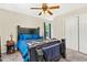 Large main bedroom with a ceiling fan, carpet, neutral paint, and windows at 5860 Andover Dr, Graham, NC 27253