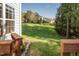 Beautiful view of the backyard and house exterior from the top of the backyard deck at 612 Spring Meadow Dr, Durham, NC 27713