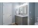 Bathroom features a vanity with marble countertop, wood look floor and modern fixtures at 612 Spring Meadow Dr, Durham, NC 27713
