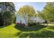 Charming two-story home featuring an immaculate, professionally landscaped front yard at 612 Spring Meadow Dr, Durham, NC 27713