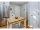Bright kitchen showcases stainless appliances and an island with a butcher block counter top at 612 Spring Meadow Dr, Durham, NC 27713