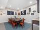 Dining room with a large table, seating for ten, and decorative wall art at 6824 Wood Forest Dr, Cary, NC 27519