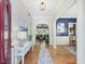 Elegant foyer featuring hardwood floors, decorative lighting, and an open floor plan at 6824 Wood Forest Dr, Cary, NC 27519