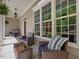 Welcoming front porch with ample seating, large windows, and serene outdoor views at 6824 Wood Forest Dr, Cary, NC 27519