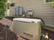 Exterior shot of a home generator, providing backup power, ensuring comfort and security during outages at 6824 Wood Forest Dr, Cary, NC 27519
