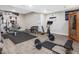 Home gym with various exercise equipment and space for workouts at 6824 Wood Forest Dr, Cary, NC 27519