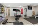 Home gym with treadmill, weight rack, and ample space for fitness activities at 6824 Wood Forest Dr, Cary, NC 27519