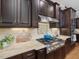 Close-up of gourmet kitchen featuring stainless steel appliances and granite countertops at 6824 Wood Forest Dr, Cary, NC 27519
