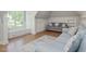 Bright living room featuring two sofas, large windows, and custom built ins at 6824 Wood Forest Dr, Cary, NC 27519
