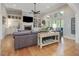 Bright living room boasting a fireplace, built-in shelves, and large windows for natural light at 6824 Wood Forest Dr, Cary, NC 27519