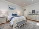 Bright main bedroom boasts a large bed, decorative accents, and a serene atmosphere at 6824 Wood Forest Dr, Cary, NC 27519