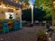 Covered outdoor bar with seating area, offering a perfect spot for relaxing and enjoying the outdoors at 6824 Wood Forest Dr, Cary, NC 27519