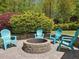 Firepit area with comfortable Adirondack chairs, ideal for gathering with friends and Gathering outdoors at 6824 Wood Forest Dr, Cary, NC 27519