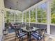 Charming screened porch with comfortable seating and beautiful views at 6824 Wood Forest Dr, Cary, NC 27519