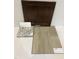 Interior design elements featuring a brown cabinet sample, granite countertops, tile backsplash, and wood floors at 75 Cordoba Dr, Franklinton, NC 27525