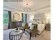 Serene main bedroom with elegant decor, comfortable seating area, and a large window view at 75 Cordoba Dr, Franklinton, NC 27525