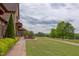 A covered patio offers scenic golf course views and an inviting outdoor seating area at 7633 Summer Pines Way, Wake Forest, NC 27587