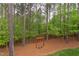 Spacious backyard with a charming swing set, perfect for outdoor recreation at 7633 Summer Pines Way, Wake Forest, NC 27587