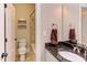 Bathroom featuring a toilet, tub with shower, sink, and tiled flooring at 7633 Summer Pines Way, Wake Forest, NC 27587