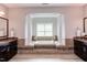 Bathroom with a soaking tub, columns, and dual vanities at 7633 Summer Pines Way, Wake Forest, NC 27587