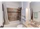 Bathroom featuring a toilet, tub with shower, sink, and tiled flooring at 7633 Summer Pines Way, Wake Forest, NC 27587
