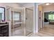 Bathroom featuring a walk-in shower with glass enclosure and dark vanity with granite countertop at 7633 Summer Pines Way, Wake Forest, NC 27587