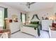 Comfortable bedroom with green accents and lots of natural light at 7633 Summer Pines Way, Wake Forest, NC 27587