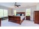 Primary bedroom with a sleigh bed, ceiling fan, and lots of natural light at 7633 Summer Pines Way, Wake Forest, NC 27587