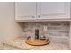 Elegant countertop with stylish decor and a sophisticated backsplash at 7633 Summer Pines Way, Wake Forest, NC 27587