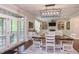 Open-concept dining room with hardwood floors and access to the living room and outdoor space at 7633 Summer Pines Way, Wake Forest, NC 27587